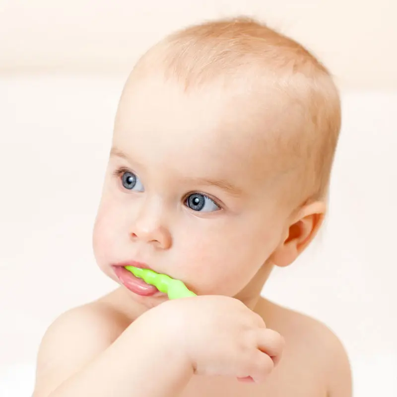 Young boy and girl brushing their teeth happily