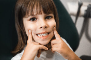 happy child at pediatric dentist's office