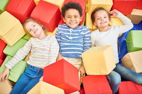 children on soft blocks